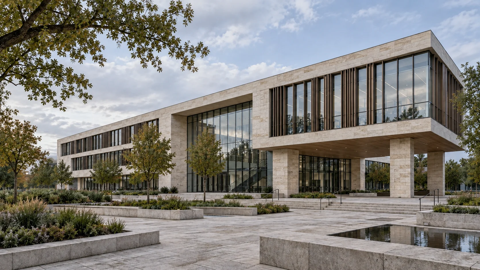 Contemporary learning campus with limestone facades, bronze fins and large windows reflecting the sky