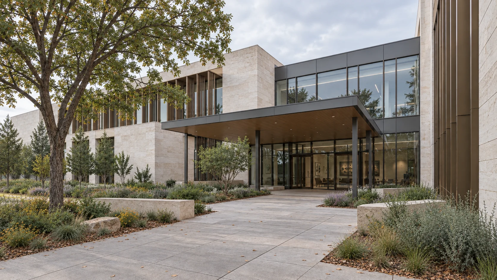 Two-story medical pavilion with a sheltered glass entrance and a landscaped courtyard